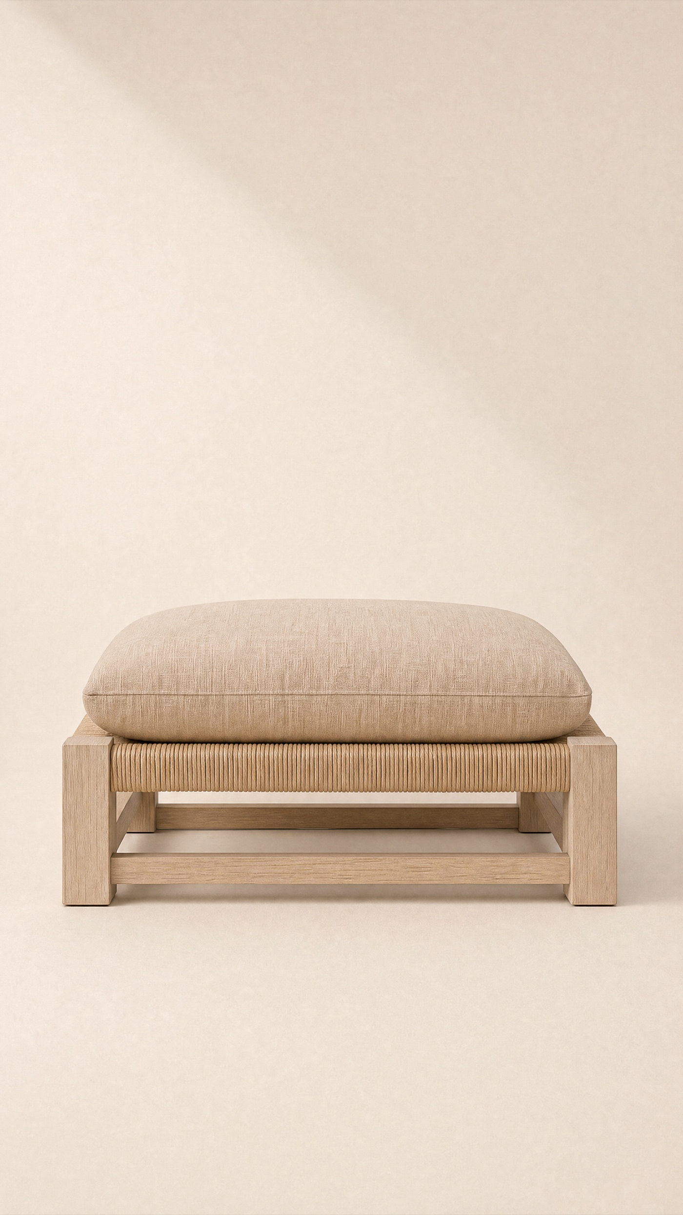 Strand Ottoman — the full studio frame.