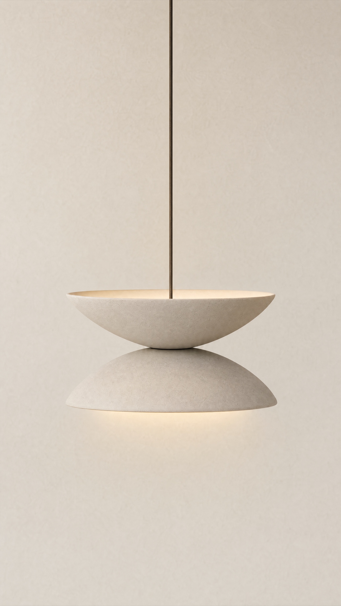 Saucer Pair Pendant — the full studio frame.